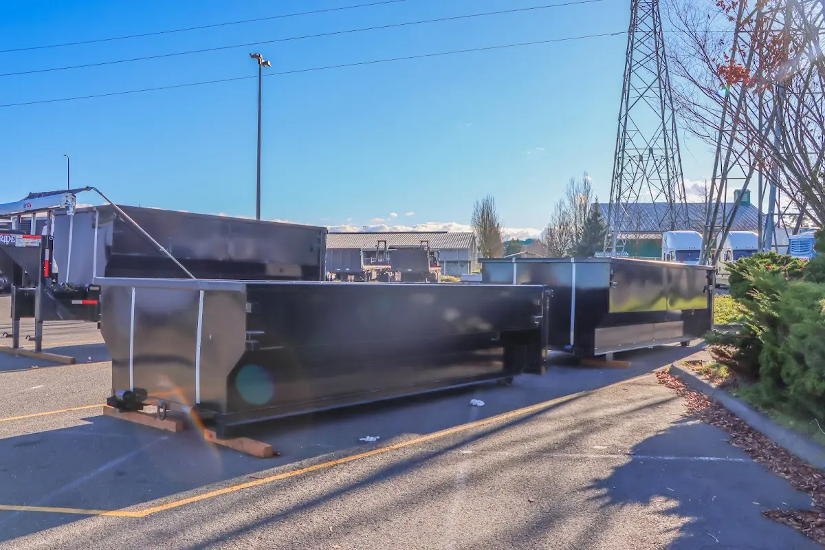 Roll-off dumpster ready for waste disposal at job site for 2 Yard Dumpster Rental in Eastham